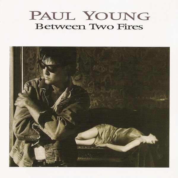 Обложка Paul Young — Between Two Fires